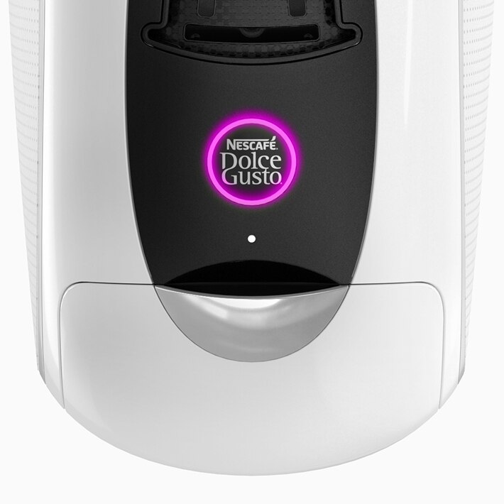 Macchina da caffè NEO Latte bianca con pulsante di avvio illuminato viola.